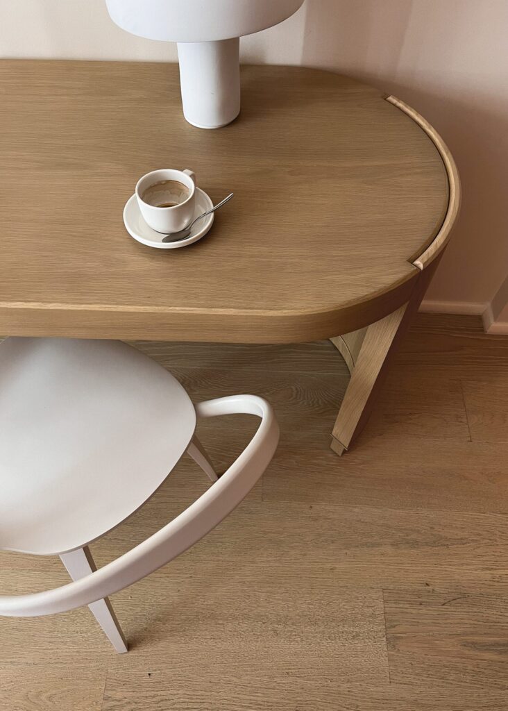 A loving mother engaging with her children in an outdoor painting activity, fostering creativity and bonding.